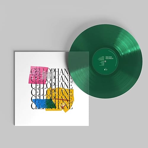 Emerald green vinyl record with white album cover featuring colorful text.
