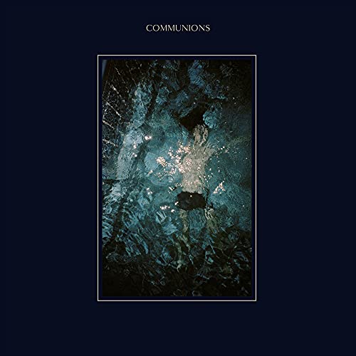 Dark blue album cover with abstract, textured imagery and white text.