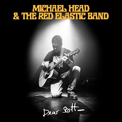 Black and white album cover featuring a man playing acoustic guitar.