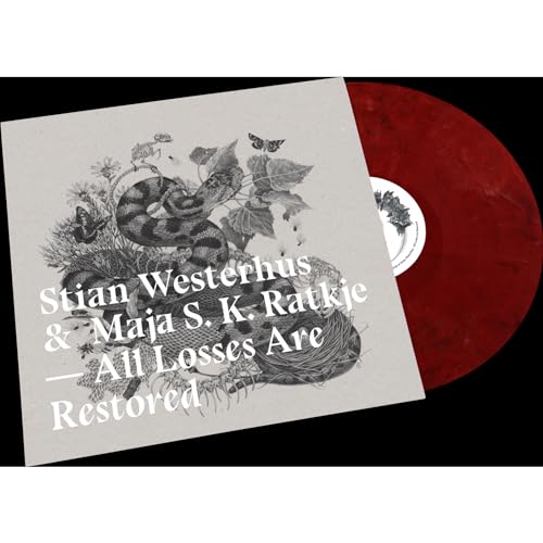 Vinyl record with cover art of a snake and botanical illustration.