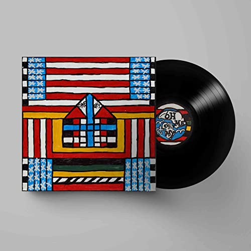 Vinyl record with colorful, patterned album cover depicting a house.