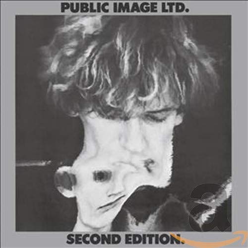 Black and white album cover featuring a distorted, surreal portrait of a person.