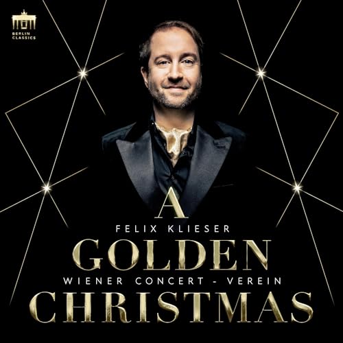 Felix Klieser in a tuxedo against a black background with gold starburst lines.