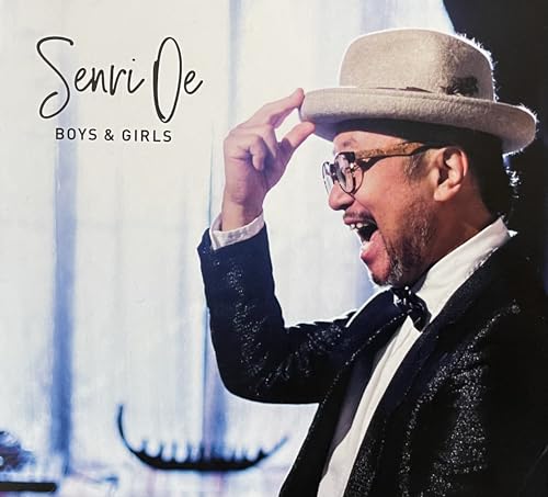 CD cover featuring a man in a suit and hat, smiling.