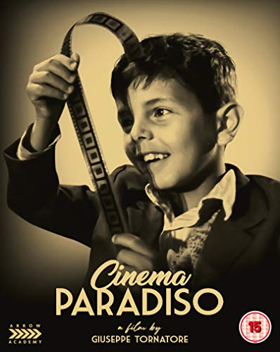 Sepia-toned image of a young boy holding a strip of film to his forehead.