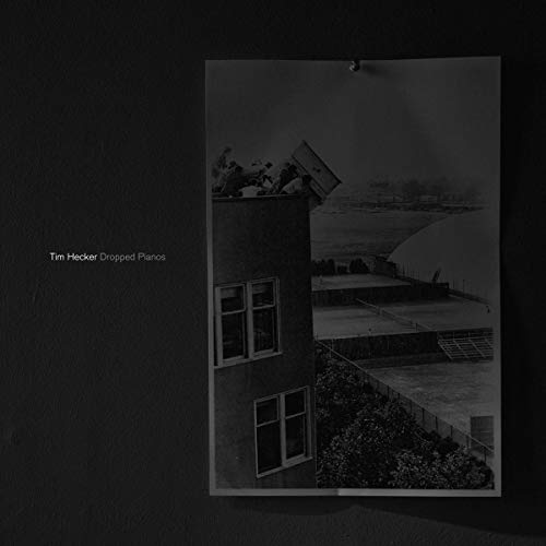 Black and white album cover featuring a building and distant landscape.
