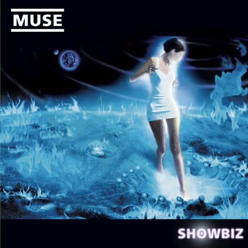 Muse “Showbiz” vinyl album cover: woman in a blue, surreal landscape.