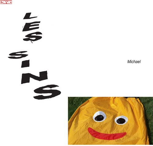 CD cover with black text "Les Sins" and a yellow, smiling face below.