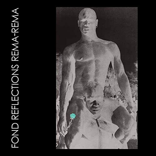 Black and white album cover featuring two shirtless men with a blue flower.