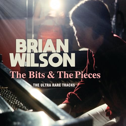 Album cover of Brian Wilson playing a piano with text The Bits & Pieces.