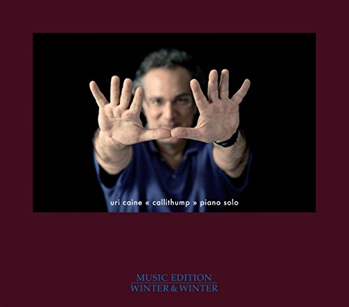 Uri Caine album cover with musician facing forward, hands outstretched.