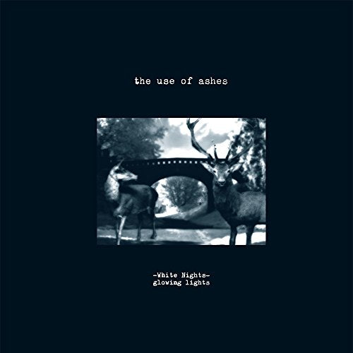 Black and white album cover with deer under a stone bridge.