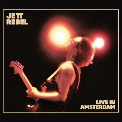 Jett Rebel album cover: musician with guitar, stage lights, Amsterdam.