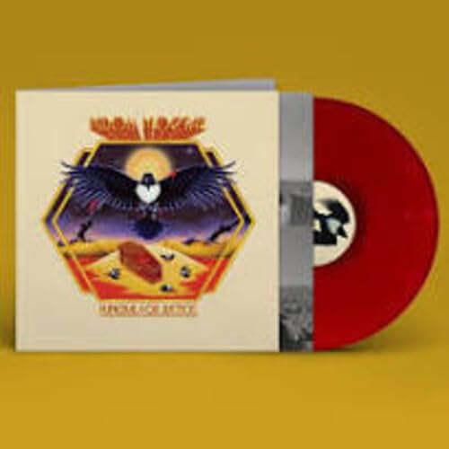 Vinyl record with cover art featuring a bird and desert landscape.