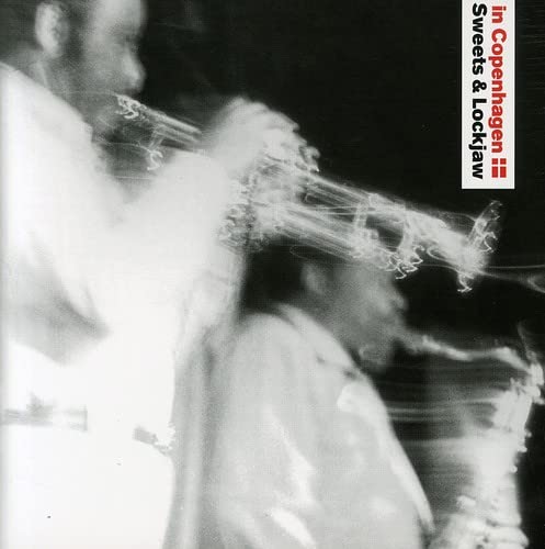 Black and white CD cover with blurred figures and smoke effects.