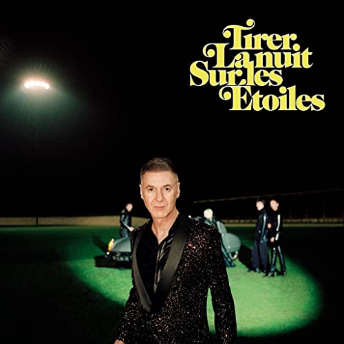 CD cover: Etienne Daho in a sparkly suit, nighttime scene.