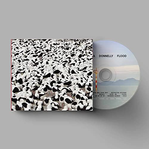Stella Donnelly’s “Flood” CD case and disc with a bird image.