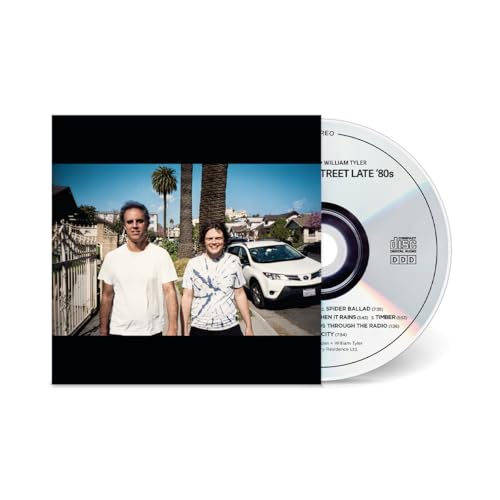 CD case with two people standing in front of a suburban street.