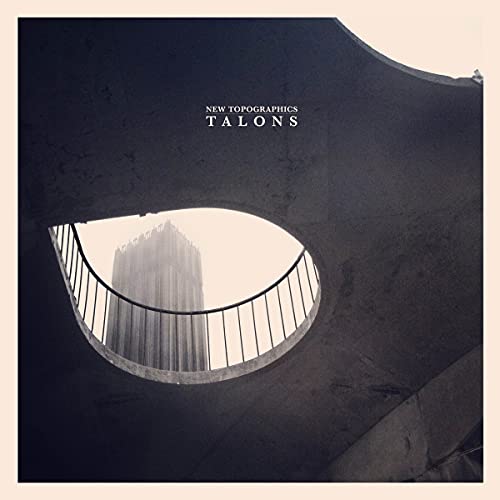 Record cover: building viewed through an arched concrete opening.