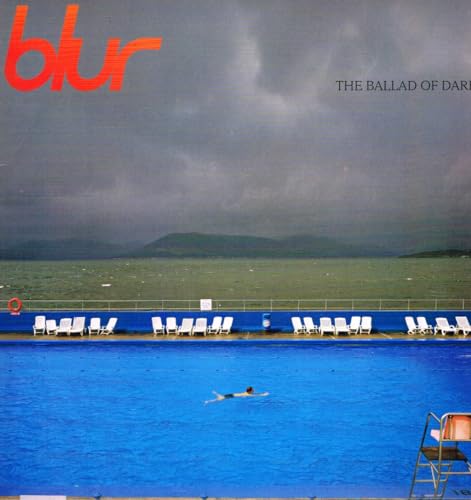 Blur album cover: outdoor swimming pool with stormy sky above.