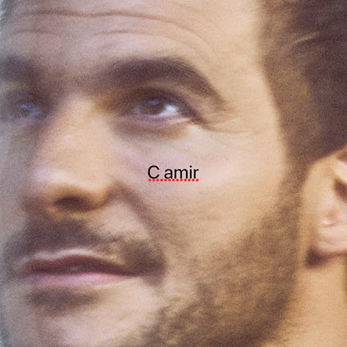 Close-up portrait of a man with facial hair and album title “C amir”.
