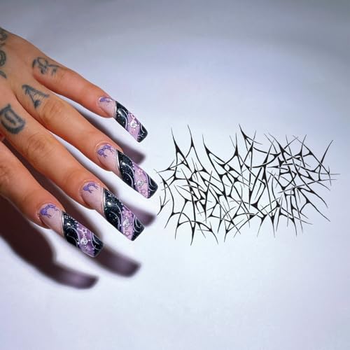 Hand with decorated nails near abstract black spiky lettering.