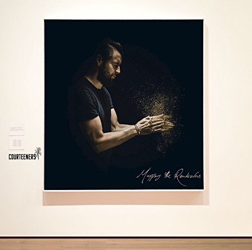 CD cover: man with outstretched hands and golden particles.