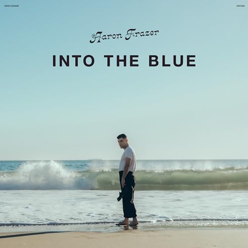 Album cover: man on beach with ocean waves, pale blue sky.