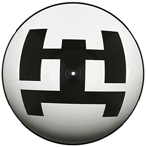 Black and white vinyl record with a geometric, abstract design.