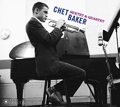 Black and white photo of Chet Baker playing trumpet near a piano.