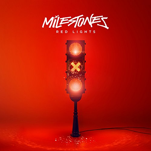 Red album cover featuring a traffic light on red, with text “MILESTONES”.