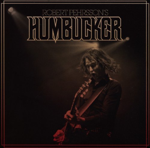 Album cover featuring a guitarist performing under a spotlight.