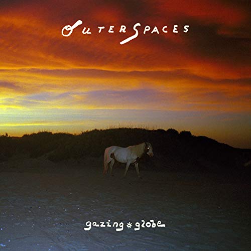 Album cover with a horse on a beach under a colorful sunset.