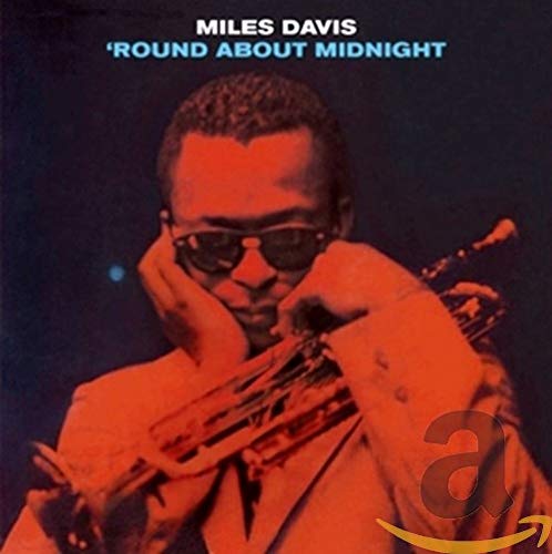 Miles Davis album cover, “Round About Midnight,” featuring a portrait of Davis with a trumpet.