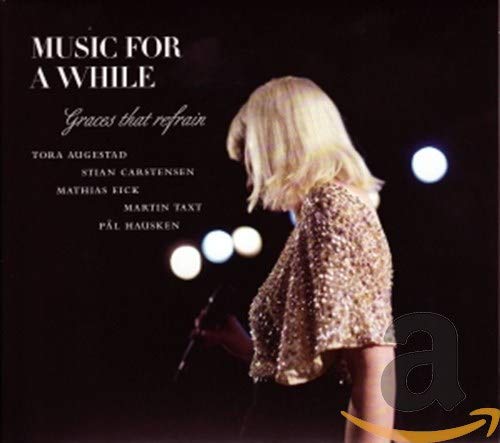 CD cover: woman with blonde hair, shimmering dress, dark background.
