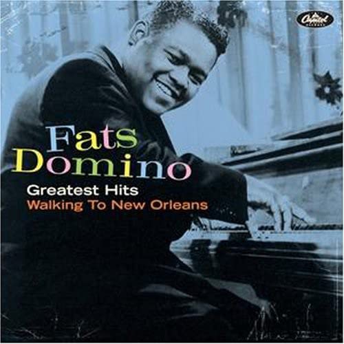 Fats Domino album cover featuring a smiling portrait at a piano.