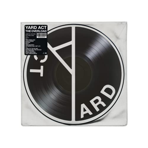 Yard Act's "The Overload" vinyl record with black and white geometric design.