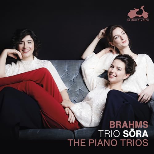 CD cover featuring three women relaxing on a grey sofa.