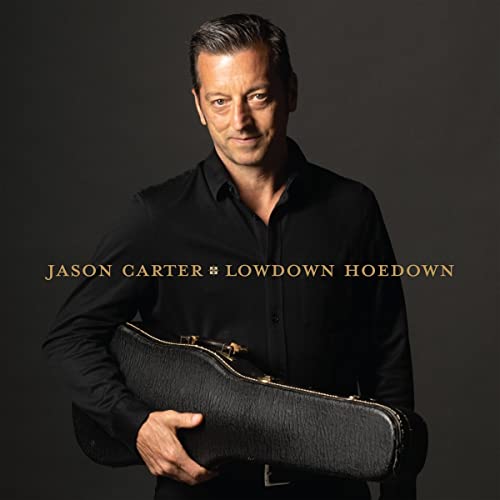 Jason Carter album cover: man with guitar case, dark background.