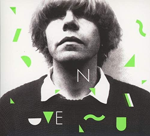 Black and white portrait of Tim Burgess with green geometric shapes.