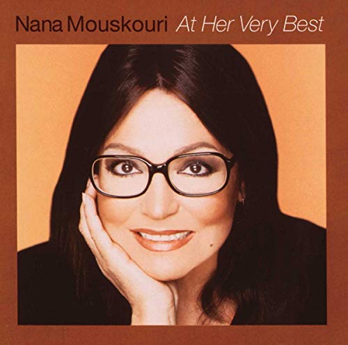 Nana Mouskouri album cover, portrait of a smiling woman with dark hair.