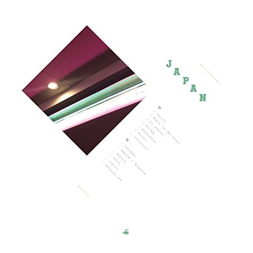 Vinyl record cover for Suicideyear’s “Japan” with abstract, angled design.
