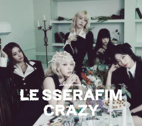 Le Sserafim album cover: five women in black outfits, floral centerpiece.