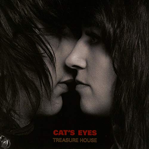 Close-up of two faces with dark hair, album cover for Cat's Eyes.