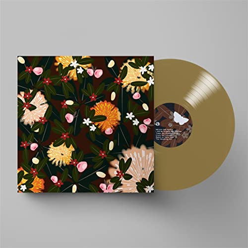 Vinyl record with floral album art and a champagne-colored disc.