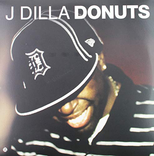 J Dilla’s “Donuts” vinyl cover featuring a smiling face under a baseball cap.