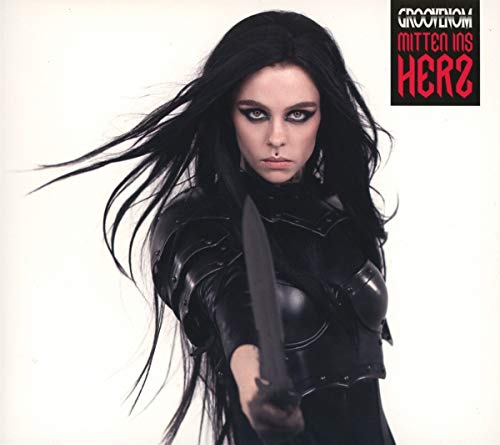 Woman with long dark hair holds a knife, album cover art.