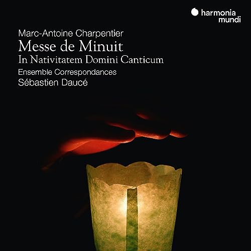 CD cover: lit candle with a hand reaching down from above.