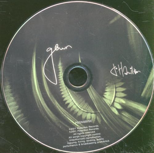 CD with swirling green design and handwritten text, "gown" and signature.