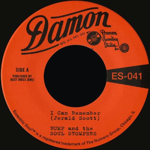 Orange vinyl record label with black text and a central hole.